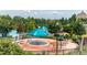 Neighborhood splash pad with sprayers and water features, surrounded by trees, umbrellas and nearby swimming pools at 149 N Serenity Hill Cir, Chapel Hill, NC 27516
