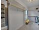 Spacious walk-in closet with custom shelving, and a stylish yellow ottoman at 149 N Serenity Hill Cir, Chapel Hill, NC 27516