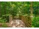 Escape into nature on this serene walking trail, surrounded by lush greenery and mature trees, perfect for a peaceful stroll at 149 N Serenity Hill Cir, Chapel Hill, NC 27516