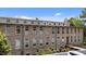 Beautiful stone building with numerous windows, offering great natural light and views at 1500 River Mill Dr # 101, Wake Forest, NC 27587