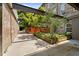 Outdoor patio showcasing modern design with stone and brick walls and lush landscaping at 1500 River Mill Dr # 101, Wake Forest, NC 27587