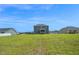 View of the back of the house from the open and grassy back yard at 1505 Willow Landing Way, Willow Springs, NC 27592
