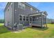 Exterior shot of the house with screened in porch and large yard at 1505 Willow Landing Way, Willow Springs, NC 27592