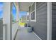 Covered front porch offers a cozy spot to relax and enjoy the neighborhood views at 1505 Willow Landing Way, Willow Springs, NC 27592