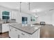 Stylish kitchen island with granite countertops provides ample workspace and seating at 1505 Willow Landing Way, Willow Springs, NC 27592