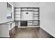 Bright home office featuring custom built-ins, drawers and cabinets, and a hardwood floor at 1505 Willow Landing Way, Willow Springs, NC 27592