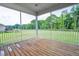 View from the screened in porch to the large, tree lined yard at 1505 Willow Landing Way, Willow Springs, NC 27592