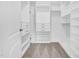 Spacious walk-in closet featuring custom shelving, drawers, and ample storage space at 1505 Willow Landing Way, Willow Springs, NC 27592