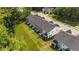 Aerial view of townhomes featuring green lawns, patios, and landscaping in a suburban community at 156 Velvet Ridge Way, Garner, NC 27529