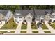An aerial view of neat townhomes with manicured lawns and driveways on a sunny day at 156 Velvet Ridge Way, Garner, NC 27529
