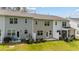Townhome backyard featuring patios, green space, and privacy fences, is perfect for outdoor entertaining and relaxation at 156 Velvet Ridge Way, Garner, NC 27529