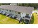 Townhome backyard features patios, green space, and privacy fences, perfect for outdoor entertaining and relaxation at 156 Velvet Ridge Way, Garner, NC 27529