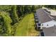 Townhome backyard featuring patios, green space, and privacy fences, is perfect for outdoor entertaining and relaxation at 156 Velvet Ridge Way, Garner, NC 27529
