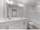 Bathroom includes a double sink vanity, and shower with tub at 156 Velvet Ridge Way, Garner, NC 27529