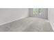 The bedroom has plush carpeting and a window for natural light at 156 Velvet Ridge Way, Garner, NC 27529
