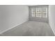 The bedroom has plush carpeting and windows for natural light at 156 Velvet Ridge Way, Garner, NC 27529