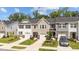 Charming townhomes with single-car garages, manicured lawns, and stone accents create an inviting curb appeal at 156 Velvet Ridge Way, Garner, NC 27529