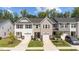 Charming townhomes with single-car garages, manicured lawns, and stone accents create an inviting curb appeal at 156 Velvet Ridge Way, Garner, NC 27529