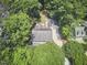 Aerial view of the home and surrounding lush green trees and landscaping at 18 Clearwater Dr, Durham, NC 27707