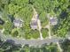 Aerial view of the home surrounded by trees on a quiet street at 18 Clearwater Dr, Durham, NC 27707