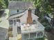 Back of a two-story home featuring a lovely deck area perfect for outdoor seating and entertaining at 18 Clearwater Dr, Durham, NC 27707
