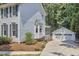 Backyard featuring a detached garage and screen porch at 18 Clearwater Dr, Durham, NC 27707