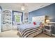 Charming bedroom with a built-in window seat, custom shelves, and a ceiling fan at 18 Clearwater Dr, Durham, NC 27707