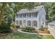 Charming two-story home with a lush green lawn and a detached garage at 18 Clearwater Dr, Durham, NC 27707