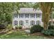 Beautiful two-story home with mature trees and landscaping at 18 Clearwater Dr, Durham, NC 27707