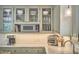 This kitchen features a glass front cabinetry, marble counters, and stainless steel appliances at 18 Clearwater Dr, Durham, NC 27707
