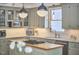 Spacious kitchen with white cabinets, marble countertops, stainless appliances and kitchen island at 18 Clearwater Dr, Durham, NC 27707