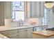 Bright kitchen features marble countertops, stainless steel appliances and pendant lighting at 18 Clearwater Dr, Durham, NC 27707