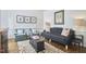 Comfortable living room showcasing a stylish sofa, armchairs, hardwood floors, and tasteful decor at 18 Clearwater Dr, Durham, NC 27707