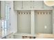 This kitchen features a mudroom area with storage lockers, hooks, and a bench at 18 Clearwater Dr, Durham, NC 27707