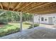 View from the covered patio of the lush yard and inviting outdoor space at 18 Clearwater Dr, Durham, NC 27707