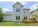 Two-story home with light blue siding and a well-maintained lawn at 1818 Misty Hollow Ln, Apex, NC 27502