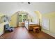Cozy bedroom with wood floors, a chair, and a bed beneath a window at 1818 Misty Hollow Ln, Apex, NC 27502