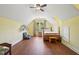 Bright, fully carpeted bedroom space under sloped ceilings with a ceiling fan at 1818 Misty Hollow Ln, Apex, NC 27502