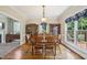 Formal dining room with hardwood floors, large windows, and traditional furniture at 1818 Misty Hollow Ln, Apex, NC 27502
