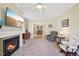 Spacious living room with fireplace, view to dining room, neutral colors and carpet at 1818 Misty Hollow Ln, Apex, NC 27502