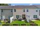Fenced backyard with green lawn, patio area and fresh plantings at 1891 Frost Dr, Haw River, NC 27258