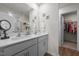 Bright bathroom features a double sink with a white quartz countertop and walk-in closet at 1891 Frost Dr, Haw River, NC 27258