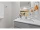 Well-lit bathroom features a white quartz countertop and sleek vanity at 1891 Frost Dr, Haw River, NC 27258