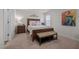 Cozy bedroom features a comfortable bed and a bench for relaxation and style at 1891 Frost Dr, Haw River, NC 27258