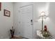 Bright entryway featuring a white front door, neutral walls, and stylish decor at 1891 Frost Dr, Haw River, NC 27258