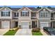 Charming townhome with a one car garage, covered entry and landscaped front yard at 1891 Frost Dr, Haw River, NC 27258