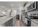 Spacious kitchen featuring stainless steel appliances, granite countertops, and a large island at 1891 Frost Dr, Haw River, NC 27258