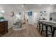 Bright living space with wood flooring and artwork leading to the kitchen area at 1891 Frost Dr, Haw River, NC 27258
