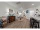 Open-concept living room features a dining area and breakfast bar for versatile living at 1891 Frost Dr, Haw River, NC 27258