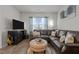 Comfortable living room featuring a large sectional sofa and ample natural light at 1891 Frost Dr, Haw River, NC 27258
